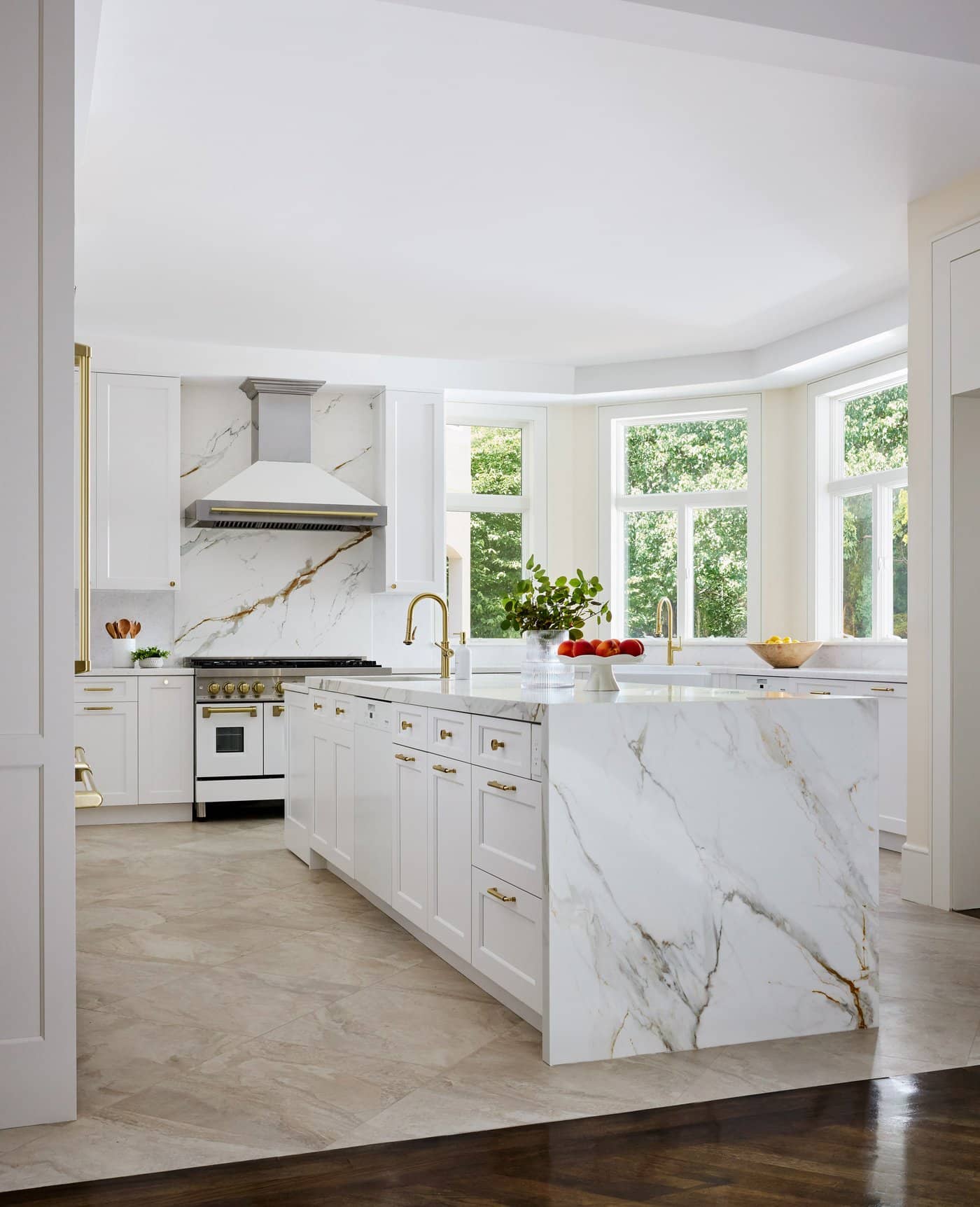 Newton Kitchens - Cutler Road kitchen with marble waterfall island and bay windows
