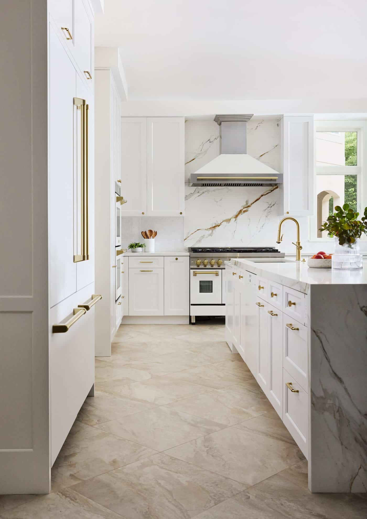Newton Kitchens - Cutler Road kitchen galley view with paneled refrigerator and marble island
